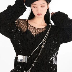 ripped oversize black sweater